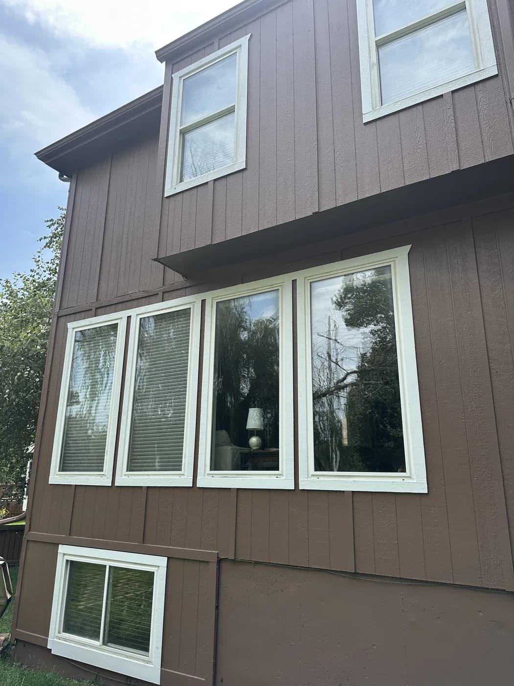 Residential window washing on a two-story house in Olathe